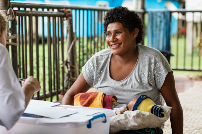 Woman with baby smilling